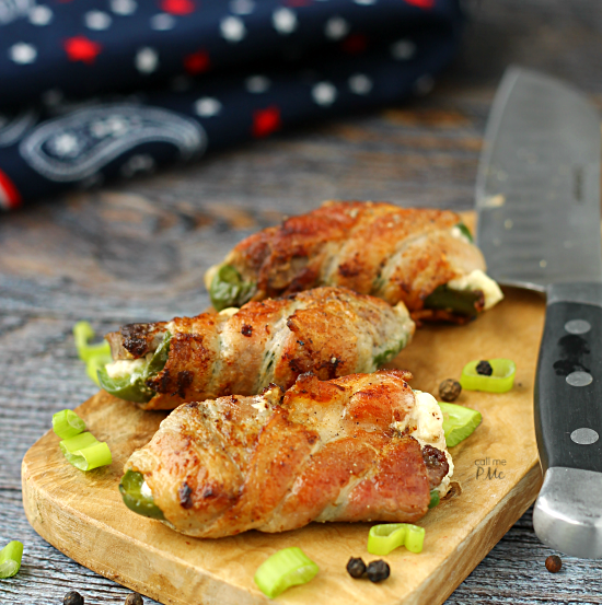 A simple filling of steak and cream cheese make these Steak Stuffed Jalapenos wrapped in bacon a popular appetizer.