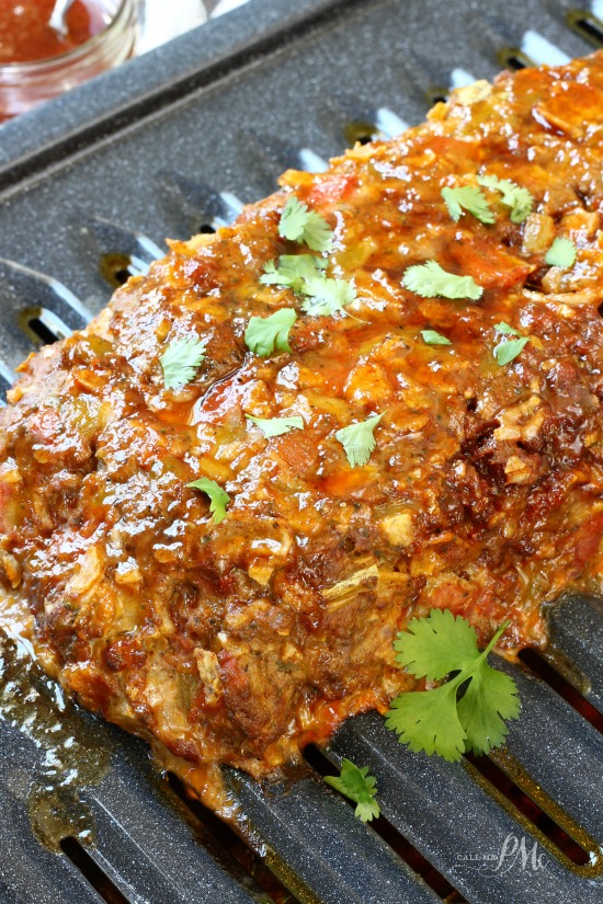 Mexican Meatloaf recipe is a tasty twist on a classic. This hearty meatloaf recipe uses spicy flavors of cumin, cilantro, green chiles and chorizo. Mexican Meatloaf recipe