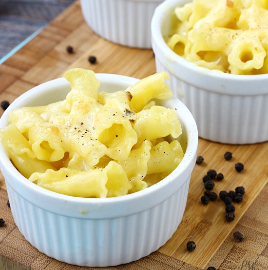 cheesy pasta in a white ramekin.