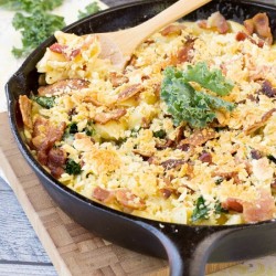 skillet of cheesy macaroni with bacon and kale.