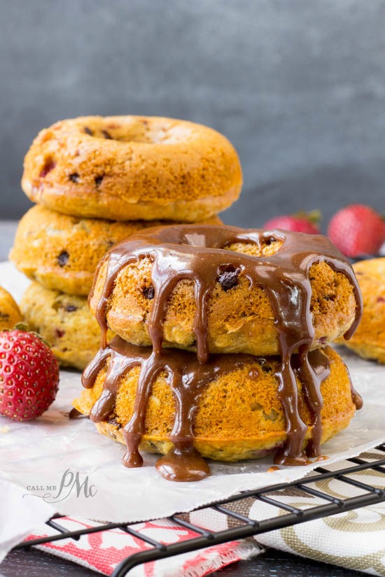 stack of chocolate chip donuts with chocolate glaze.