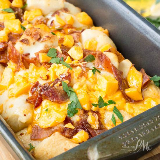 close up of bacon cheese bread in a loaf pan.