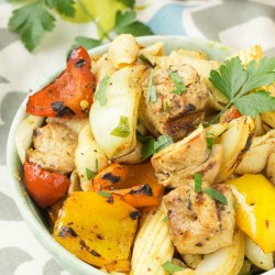 chicken fajita pasta salad in a white serving bowl.