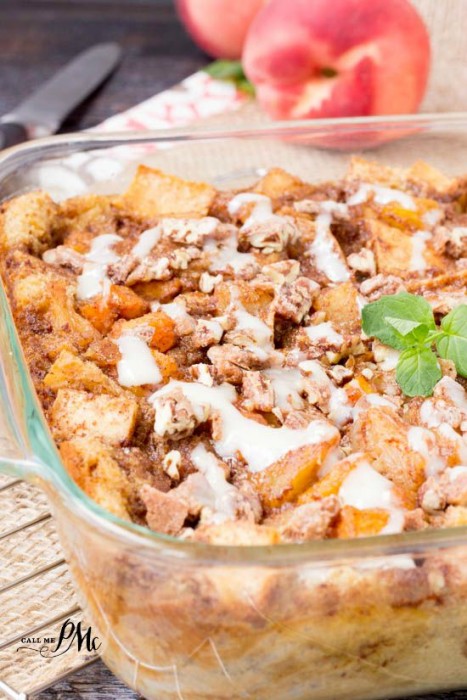 Baked peach cobbler in a glass baking dish.