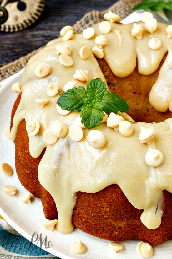Greek Yogurt Strawberry Jam Pound Cake is fluffy and moist. Smothered with white chocolate ganache this cake is h-e-a-v-e-n!! Greek Yogurt Strawberry Jam Pound Cake