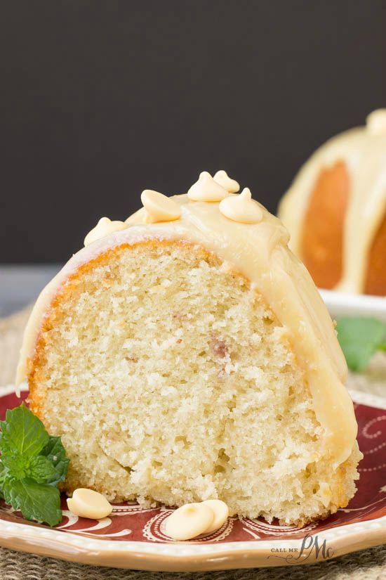 made with a Greek yogurt pound cake and a simple white chocolate ganache - GreekYogurt Strawberry Jam Pound Cake A slice of cake on a plate.