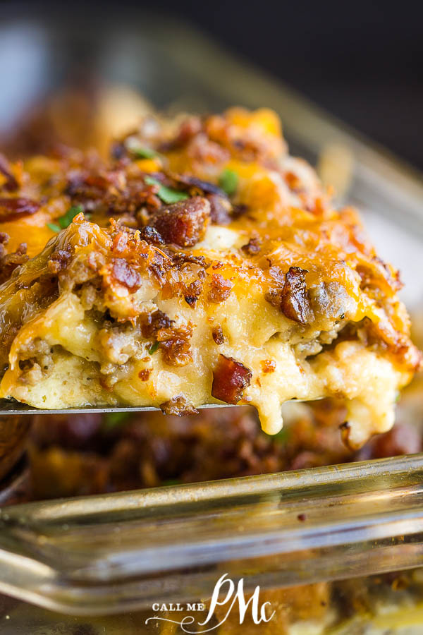 Overnight Sausage Egg Breakfast Casserole recipe is an easy to make Christmas morning or any morning family friendly easy breakfast and brunch recipe. #breakfast #brunch #recipe #casserole #sausage #cheese spoon with eggs and cheese