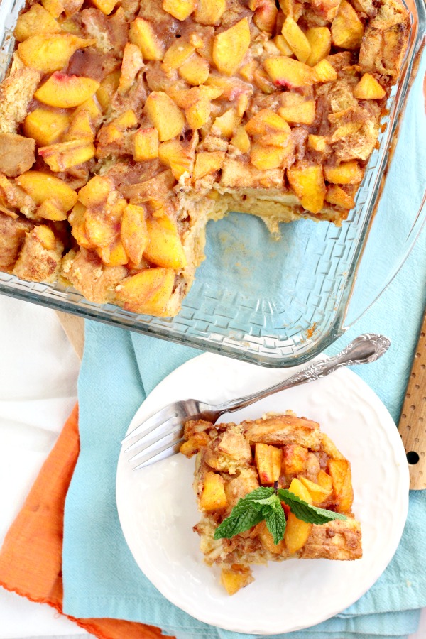 peaches over bread pudding in pan Peach Cobbler Bread Pudding