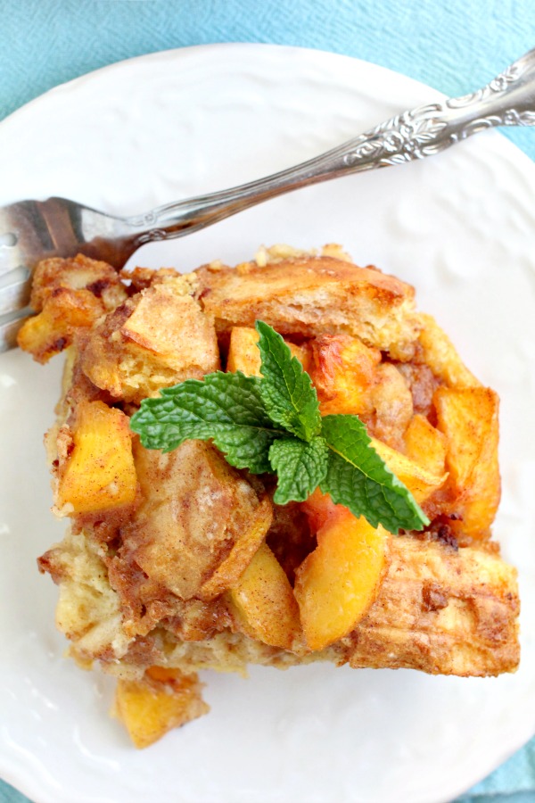 Amazingly delicious, Easy Peach Cobbler Bread Pudding is full of fresh peaches, rich custard, and a hint of rum! #breadpudding #dessert #dessertrecipes #callmepmc #recipes Peach Cobbler Bread Pudding