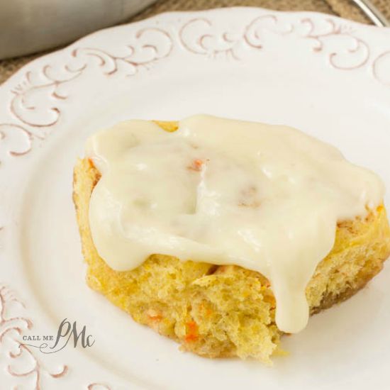 Scratch Made Carrot Cake Cinnamon Rolls with Cream Cheese Frosting recipe warm sweet rolls filled with cinnamon and butter and topped with cream cheese frosting oozing down into the warm cinnamon rolls! Great breakfast and brunch recipe. 