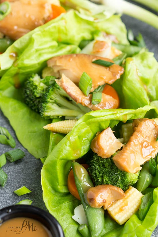 Asian Tilapia Lettuce Wraps with sauce on a tray.