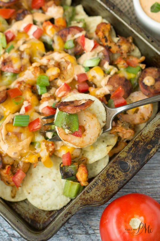 Cajun spices blended with shrimp, crawfish, sausage and ooey, gooey cheese and topped with a finger-licking Sriracha Comeback Sauce, Cajun Etouffee Nachos recipe is nacho perfection! #SausageBowl @jvillesausage