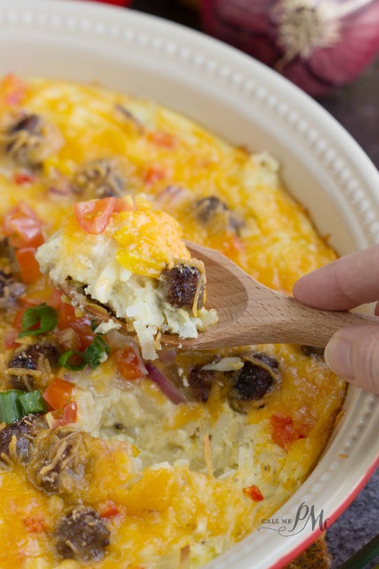 serving of breakfast hotdish on a wooden spoon.