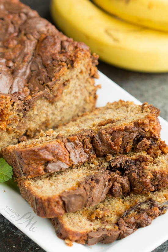 Nutella Swirled Peanut Butter Roasted Banana Bread - you're going to love this recipe. It's deliciously decadent and easy to make!