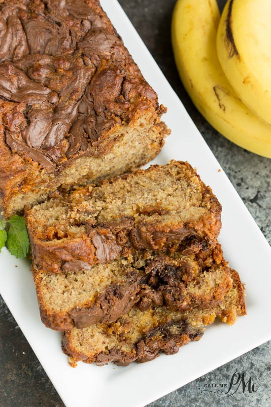 Nutella Swirled Peanut Butter Roasted Banana Bread recipe. Easy recipe. No mixer required. Loaded with extras!