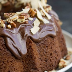 Chocolate Praline Bundt Cake is a decadent bundt cake recipe that's smothered with chocolate ganache.