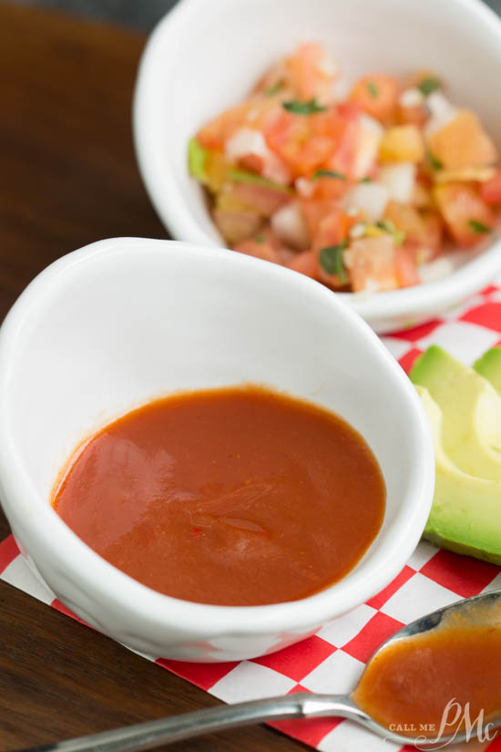 small white bowls of red enchilada sauce and pico de gallo.
