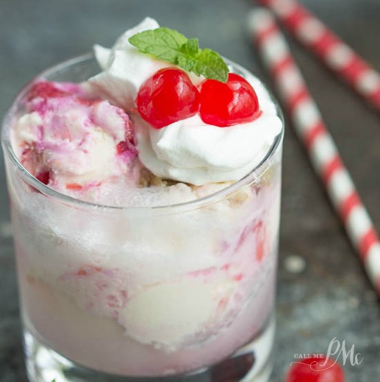 A glass full of white and pink ice cream.