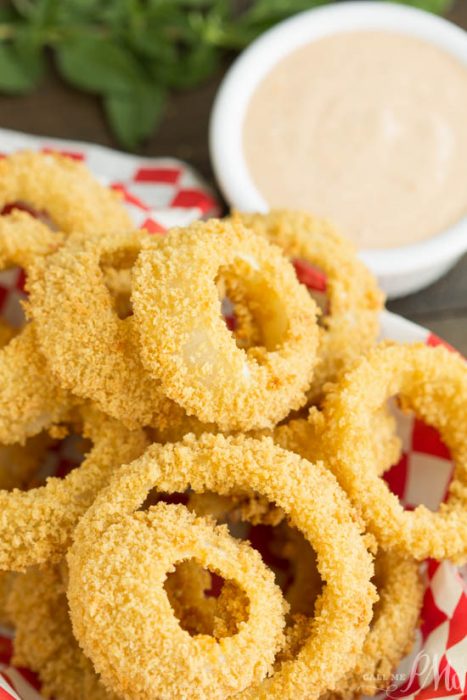 Oven Fried Onion Rings with Copycat Outback Blooming Onion Dipping Sauce. Healthier onion rings are crispy, crunchy, and paired with an amazing spicy sauce for dunking!