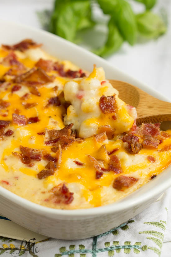 This Hominy Au Gratin casserole recipe is easy to make and super creamy. Hominy Au Gratin is an old fashioned southern staple that is a tasty and filling cheese and bacon topped side dish. Comfort food at it's best. Hominy Au Gratin casserole