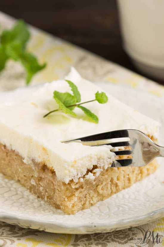 Ruby Red Grapefruit Sheet Cake with Grapefruit Cream Cheese Frosting is tender, moist, sweet, and tart. If you like citrus and grapefruit, this flavorful combination is sure to satisfy! Slice of grapefruit cake on saucer.