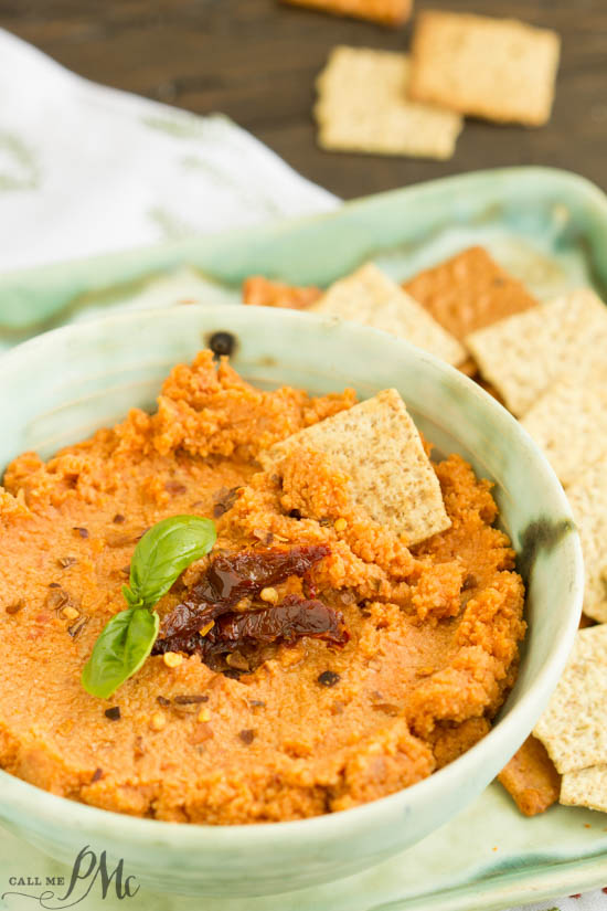 Sun Dried Tomato Hummus Recipe is creamy, spicy, and has a nice earthy flavor from the sun-dried tomatoes. This easy recipe comes together quickly and will become your go-to recipe! Sun Dried Tomato Hummus