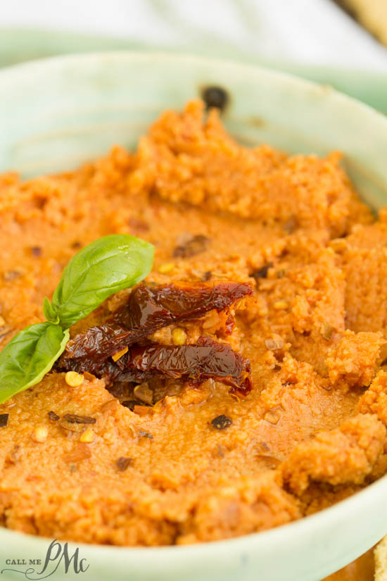 Sun Dried Tomato Hummus Recipe is creamy, spicy, and has a nice earthy flavor from the sun-dried tomatoes. This easy recipe comes together quickly and will become your go-to recipe! Sun Dried Tomato Hummus