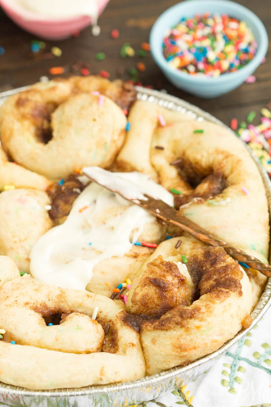 Tender and fluffy Birthday Cake Cinnamon Rolls is like having birthday cake for breakfast! Fun, festive, easy to make, and they taste heavenly! This recipe is definitely one you want to have on your breakfast roster!