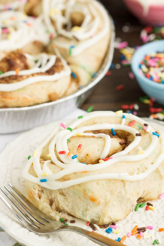 Tender and fluffy Birthday Cake Cinnamon Rolls are Fun, festive, easy to make, and they taste heavenly! This recipe is definitely one you want to have on your breakfast roster! Festive breakfast setting.