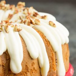 There's nothing like biting into a fresh-baked Pecan Banana Cake Mix Cake! Easy, simple, homemade goodness baked with pecans and topped with a delicious maple cream cheese frosting, and toasted pecans. This cake is perfect for any and every occasion!