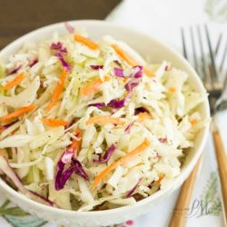 A basic cole slaw recipe, Tangy Vinegar Based Slaw is zippy and crunchy flavored with a little heat and a pinch of sweet