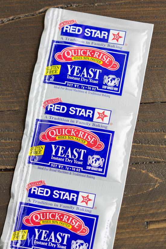 Fear not the yeast! I'm giving all the Tips for Baking with Yeast that you need to successful yeast bread! Don't let baking with yeast confuse or scare you, I've got simple guidelines to follow so you can enjoy homemade yeast bread and cinnamon rolls! Packages of Quick-rise on table.