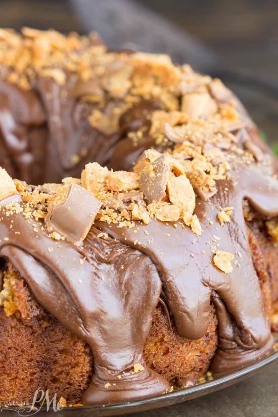Cake Mix Butterfinger Pound Cake with Chocolate Ganache is a buttery and tender cake loaded with Butterfinger candy bars. A bundt cake with frosting.