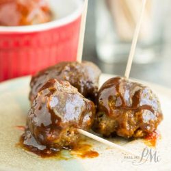 3 bourbon whiskey meatballs on toothpicks.