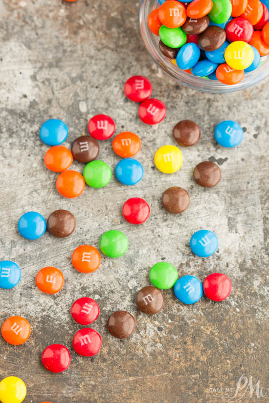 M&M Cinnamon Rolls make a fun and delicious carefree breakfast treat! M&M s on the table.