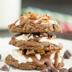 Mississippi Mud Cookies with Marshmallow Fluff and Chocolate Frosting is a delectable fudge cookie recipe topped with creamy marshmallow fluff frosting, rich chocolate ganache, and salted toasted pecans.