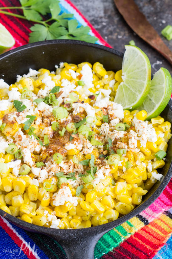 Skillet Mexican Street Corn Recipe is corn off the cobb served Mexican style. It's smothered with a creamy spread and topped with feta cheese, cilantro, and green onions. #corn #streetcorn #recipe #TexMex #feta #butter #easy #sidedish