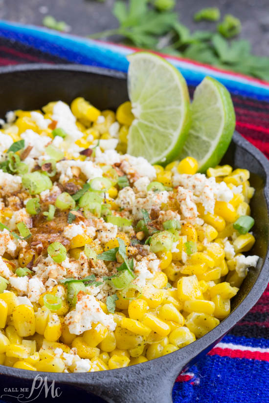 Skillet Mexican Street Corn Recipe is corn off the cobb served Mexican style it's smothered with a creamy spread and topped with feta cheese, cilantro, and green onions. Delicious side dish.