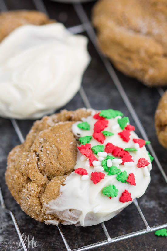 Perfectly flavored, Blue Ribbon Chewy Molasses Ginger Cookies recipe have a snap from the sugar on the outside but are luscious and chewy without being cakey on the inside. Christmas decorated biscuits on a wire rack.