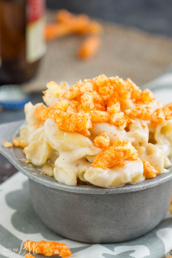 A bowl of indulgent cheese pasta crowned with crumbled Cheetos for an irresistible crunch.