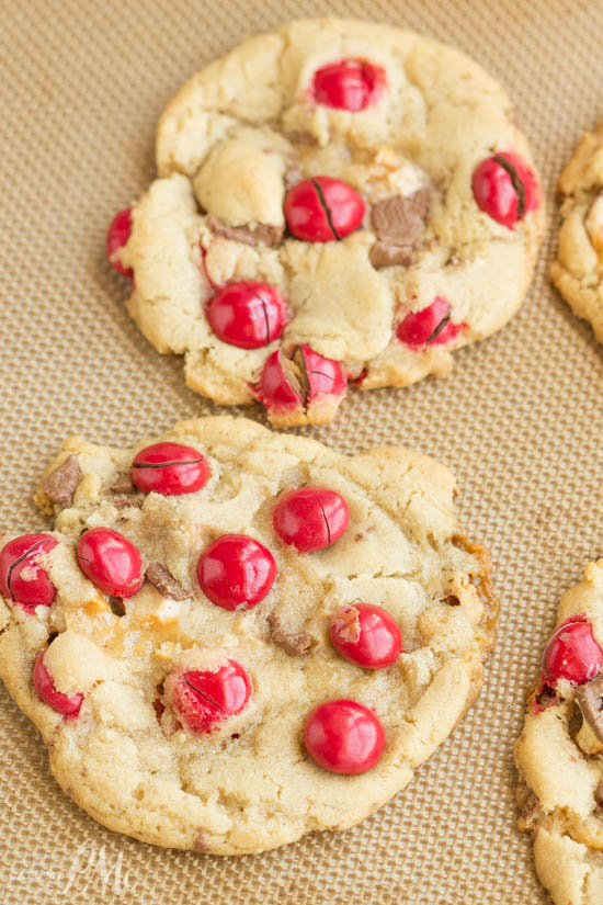 Peanut Butter M&M Snickers Cookies are soft and chewy cookies I filled with peanut butter M&M candies and chopped Snickers candy bars. They are the ultimate sugar rush! REcipe. cookie. dessert. Peanut Butter M&M Snickers Cookies
