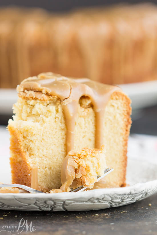 One slice of pound cake with caramel icing and one bite of the cake on a fork. 