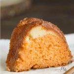 Orange Bundt Cake is tender with wonderful citrus flavor. It has a ribbon of orange zest filled cream cheese in it making it a moist & delicious recipe