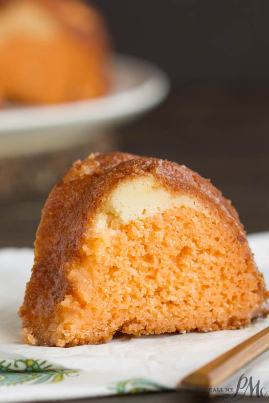 Orange Bundt Cake is tender with a wonderful citrus flavor. It has a ribbon of orange zest filled sweetened cream cheese running through it making it a moist and delicious recipe.