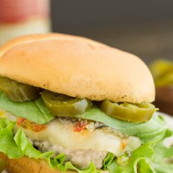 Spicy Jalapeno Pepper Jelly and Basil Sauce Pork Burgers is a fresh and delicious spin on a hamburger recipe. A peppery and spicy sauce beautifully flavors ground pork burgers.