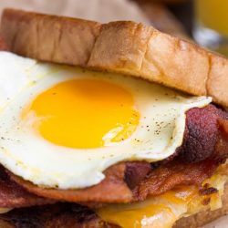 Boy Scout Bacon Hash Brown Breakfast Sandwich recipe is a big, bad breakfast sandwich with all your favorite breakfast foods in one convenient, hand-held package!