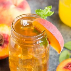 Bourbon Peach Tea Cocktail southern inspired flavors of bourbon and peaches. Turn any party into a celebration with this fun and easy drink!