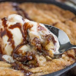 Your answer to a cookie craving! Crave Tupelo Deluxe Chocolate Chip Skillet Cookie has perfectly crispy edges with a gooey, chewy center.