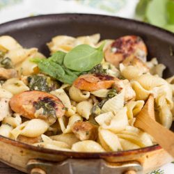 Hearty and flavorful, Creamy Spinach Artichoke Sausage and Chicken Pasta is a 20-minute weeknight meal for your family.