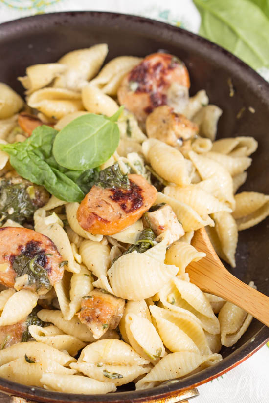 Hearty and flavorful, Creamy Spinach Artichoke Sausage and Chicken Pasta is a 20-minute weeknight meal for your family.